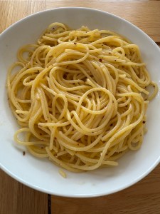 A plate of Spaghetti Aglio e Olio, featuring spaghetti tossed in olive oil, garlic, and red pepper flakes—a simple and classic Italian dish.