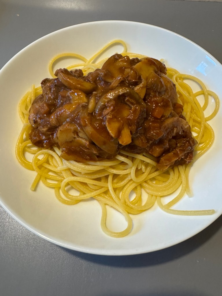 Helen’s serving of Jamie Oliver beef ragu with mushrooms on gluten free spaghetti, plated as a smaller gluten free meal.