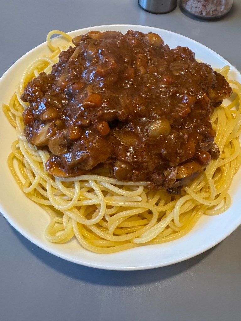 A large portion of gluten free spaghetti topped with Jamie Oliver’s beef ragu and added mushrooms, served as Ben’s gluten free dinner.