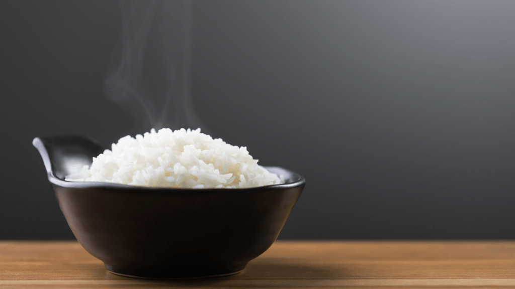 Steaming bowl of plain white rice served as a gentle gluten free food after accidental gluten exposure